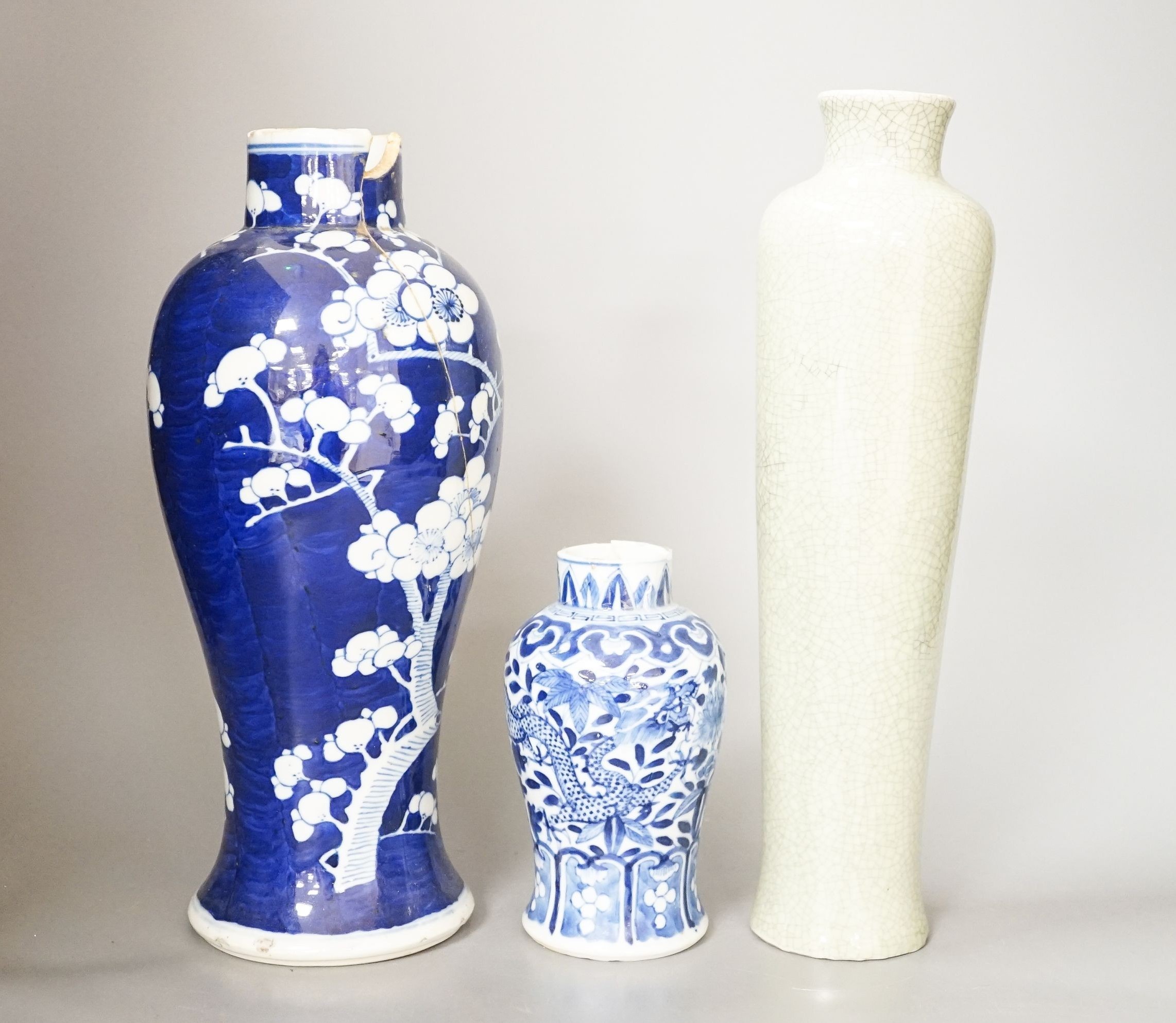 Two Chinese blue and white vases and a slender crackle glaze vase, Qing and later 30cm